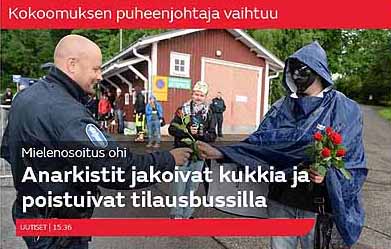 Anarkisti antaa ruusun poliisille 2014